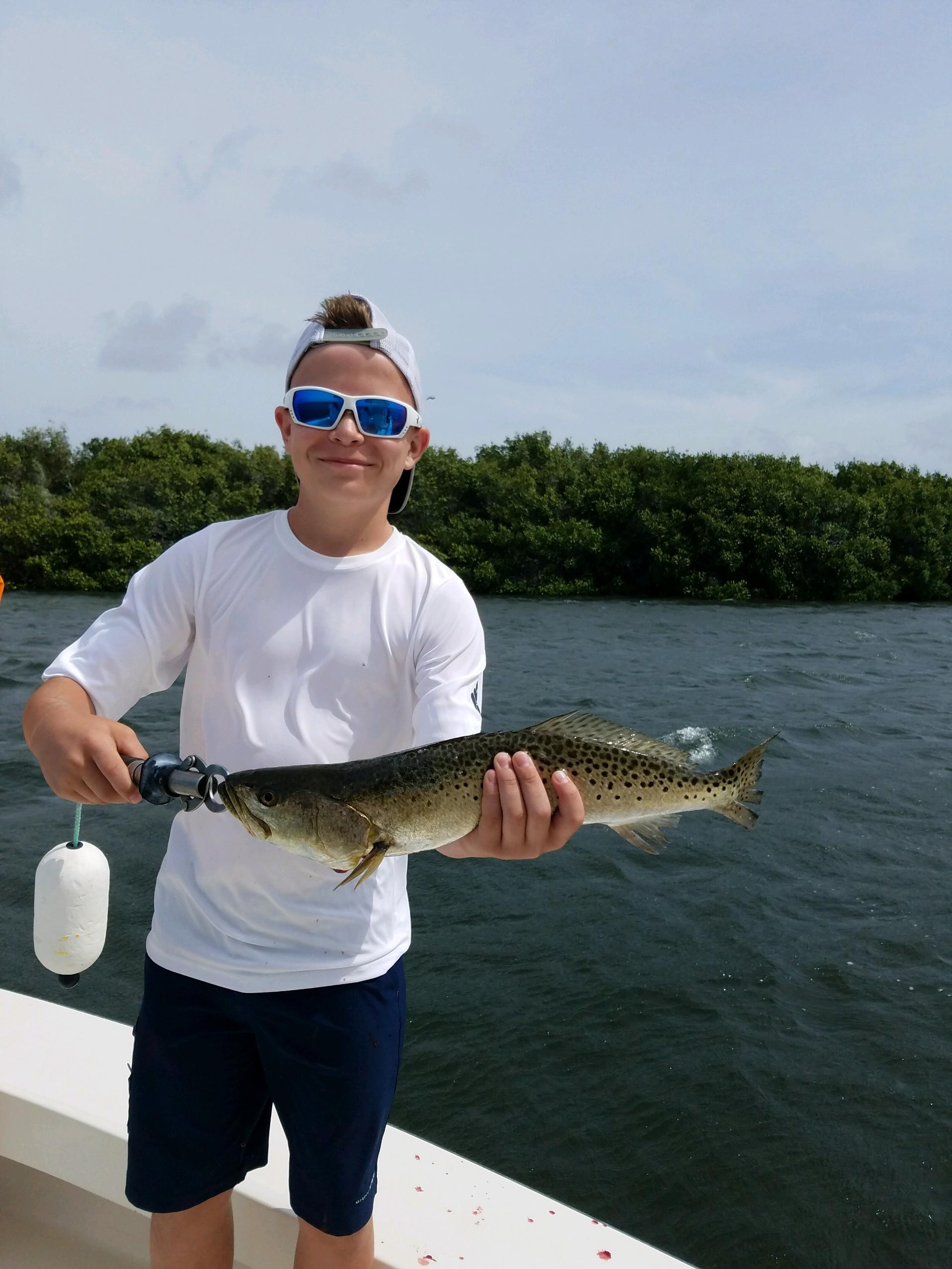Boy Holding Spotted Sea Trout Charlotte Harbor