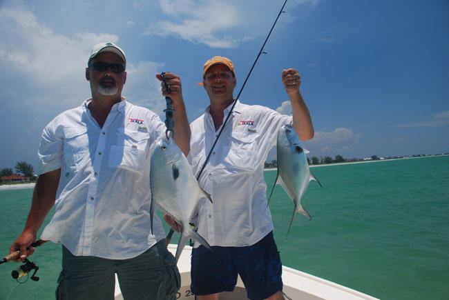 Two Men Holding a Permit Fish Each, Boca Grande